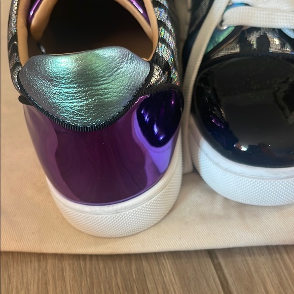 Black & Purple Women's Sneakers
made in Paris by Christian LOUBOUTIN
Red bottom - Picture 11 of 16